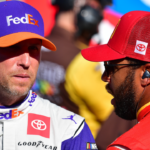 Oct 15, 2022; Las Vegas, Nevada, USA; NASCAR Cup Series driver Denny Hamlin (11) speaks with driver Bubba Wallace (45) during practice at Las Vegas Motor Speedway. Mandatory Credit: Gary A. Vasquez-Imagn Images