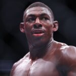 Joaquin Buckley (blue gloves) reacts after the fight against Colby Covington (red gloves) at Amalie Arena.