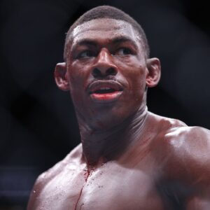 Joaquin Buckley (blue gloves) reacts after the fight against Colby Covington (red gloves) at Amalie Arena.