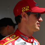 Feb 16, 2025; Daytona Beach, Florida, USA; NASCAR Cup Series driver Joey Logano (22) walks to the drivers meeting before the Daytona 500 at Daytona International Speedway. Mandatory Credit: Peter Casey-Imagn Images