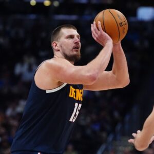 Denver Nuggets center Nikola Jokic (15) prepares to shoot the ball in the second half against the Oklahoma City Thunder at Ball Arena