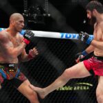 ; Alex Pereira (red gloves) fights Magomed Ankalaev (blue gloves) during UFC 313 at T-Mobile Arena.