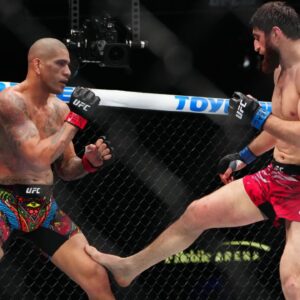 ; Alex Pereira (red gloves) fights Magomed Ankalaev (blue gloves) during UFC 313 at T-Mobile Arena.