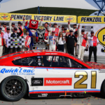 Mar 16, 2025; Las Vegas, Nevada, USA; NASCAR Cup Series driver Josh Berry (21) poses for photos following his victory of the Pennzoil 400 at Las Vegas Motor Speedway. Mandatory Credit: Gary A. Vasquez-Imagn Images
