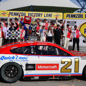Mar 16, 2025; Las Vegas, Nevada, USA; NASCAR Cup Series driver Josh Berry (21) poses for photos following his victory of the Pennzoil 400 at Las Vegas Motor Speedway. Mandatory Credit: Gary A. Vasquez-Imagn Images