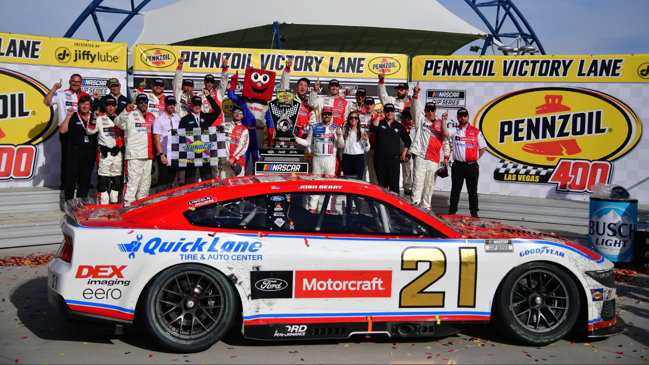 Mar 16, 2025; Las Vegas, Nevada, USA; NASCAR Cup Series driver Josh Berry (21) poses for photos following his victory of the Pennzoil 400 at Las Vegas Motor Speedway. Mandatory Credit: Gary A. Vasquez-Imagn Images