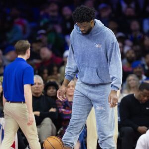 Injured Philadelphia 76ers center Joel Embiid during a timeout in the fourth quarter against the Golden State Warriors at Wells Fargo Center.