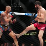 Alex Pereira (red gloves) fights Magomed Ankalaev (blue gloves) during UFC 313 at T-Mobile Arena.