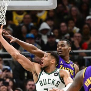 Milwaukee Bucks forward Giannis Antetokounmpo (34) takes a shot against Los Angeles Lakers center Christian Koloko (10) in the third quarter at Fiserv Forum