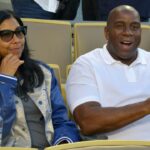 Los Angeles Dodgers partner Magic Johnson (right) and wife Cookie Johnson attend the game against the San Francisco Giants at Dodger Stadium