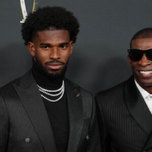 Deion Sanders (right) with his son Shedeur Sanders on the red carpet before Super Bowl LIX NFL Honors at Saenger Theatre.