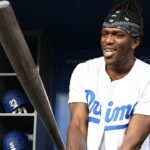 ; British YouTuber KSI and cruiserweight professional boxer swings a bat in the dugout prior to the game between the Los Angeles Dodgers and the Arizona Diamondbacks at Dodger Stadium.