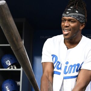 ; British YouTuber KSI and cruiserweight professional boxer swings a bat in the dugout prior to the game between the Los Angeles Dodgers and the Arizona Diamondbacks at Dodger Stadium.