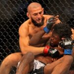 Khamzat Chimaev (red gloves) fights Kevin Holland (blue gloves) during UFC 279 at T-Mobile Arena.