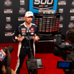 Feb 12, 2025; Daytona Beach, Florida, USA; NASCAR Cup Series driver Denny Hamlin during Daytona 500 media day at Daytona International Speedway. Mandatory Credit: Mark J. Rebilas-Imagn Images