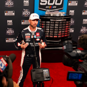 Feb 12, 2025; Daytona Beach, Florida, USA; NASCAR Cup Series driver Denny Hamlin during Daytona 500 media day at Daytona International Speedway. Mandatory Credit: Mark J. Rebilas-Imagn Images