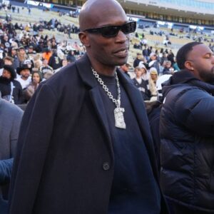 Retired American football player Chad Johnson on the sidelines before the game between the Utah Utes against the Colorado Buffaloes at Folsom Field.