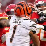 Cincinnati Bengals wide receiver Ja'Marr Chase (1) and Kansas City Chiefs safety Justin Reid (20) exchange shoves in the second quarter during a Week 17 NFL football game between the Cincinnati Bengals and the Kansas City Chiefs, Sunday, Dec. 31, 2023, at GEHA Field at Arrowhead Stadium in Kansas City, Mo.