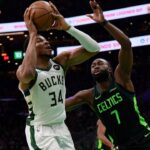 Milwaukee Bucks forward Giannis Antetokounmpo (34) drive to the basket while Boston Celtics guard Jaylen Brown (7) defends during the first half at TD Garden.