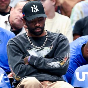 Dallas Mavericks guard Kyrie Irving sits on the bench against the Philadelphia 76ers during the first half at American Airlines Center.