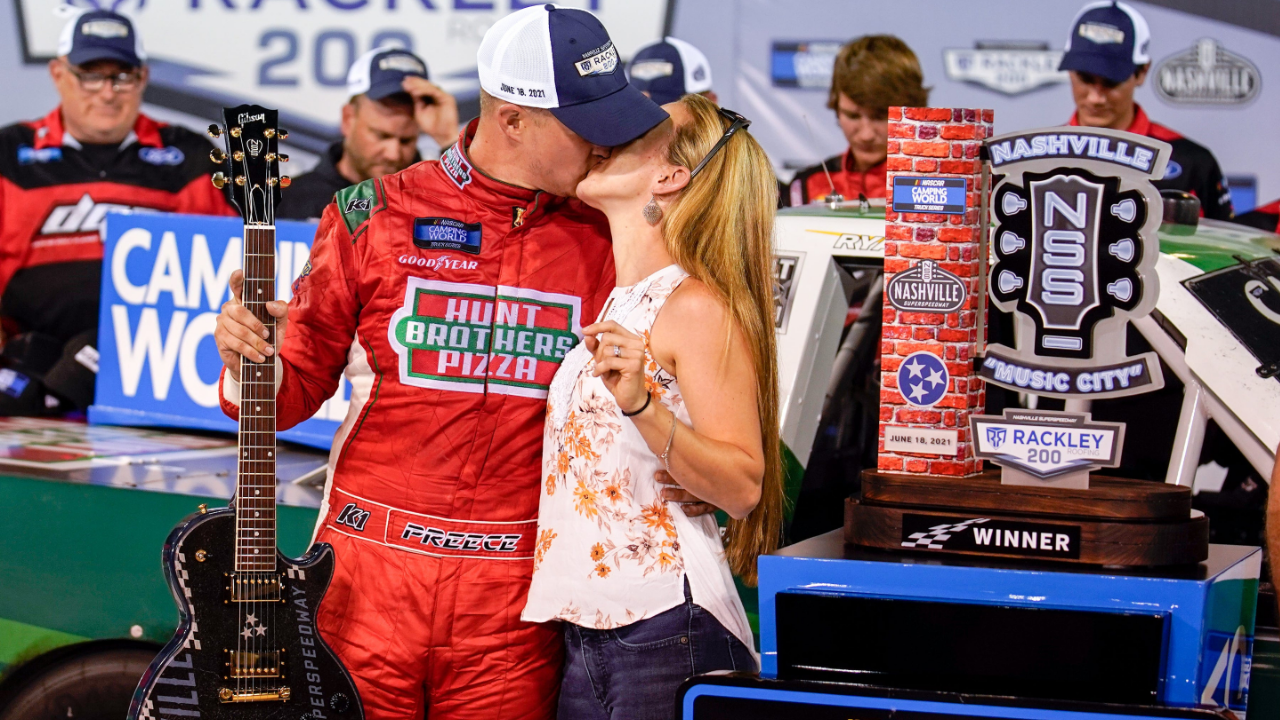 NASCAR Truck Series driver Ryan Preece kisses his wife Heather DesRochers after winning the Rackley Roofing 200 NASCAR Camping World Truck Series race at the Nashville Superspeedway in Lebanon, Tenn., Friday, June 18, 2021. Nastruck 061821 An 007