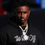 Nov 29, 2024; Boulder, Colorado, USA; Colorado Buffaloes social media producer Deion Sanders Jr. walks the sidelines in the second quarter against the Oklahoma State Cowboys at Folsom Field.