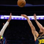 Golden State Warriors guard Stephen Curry (30) shoots over Sacramento Kings guard Zach LaVine (8) during the third quarter at Chase Center.