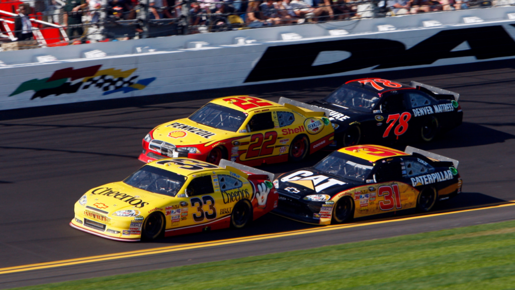Feb 19, 2011; Daytona Beach, FL, USA; NASCAR Sprint Cup Series drivers Clint Bowyer leads Kurt Busch (22) , Jeff Burton (31) and Regan Smith (78) during the Daytona 500 at Daytona International Speedway. Mandatory Credit: Jerry Lai-Imagn Images