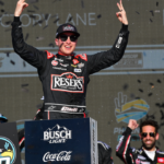 Mar 9, 2025; Avondale, Arizona, USA; NASCAR Cup Series driver Christopher Bell (20) celebrates his victory of the Shriners Children’s 500 at Phoenix Raceway. Mandatory Credit: Gary A. Vasquez-Imagn Images