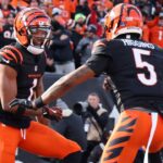 Dec 22, 2024; Cincinnati, Ohio, USA; Cincinnati Bengals wide receiver Ja'Marr Chase (1) celebrates a touchdown with wide receiver Tee Higgins (5) during the first quarter against the Cleveland Browns at Paycor Stadium.