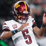 Jan 26, 2025; Philadelphia, PA, USA; Washington Commanders quarterback Jayden Daniels (5) celebrates after a play against the Philadelphia Eagles during the second half in the NFC Championship game at Lincoln Financial Field.