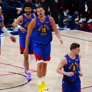 Denver Nuggets center Nikola Jokic (15), guard Jamal Murray (27) and Denver Nuggets forward Aaron Gordon (32)