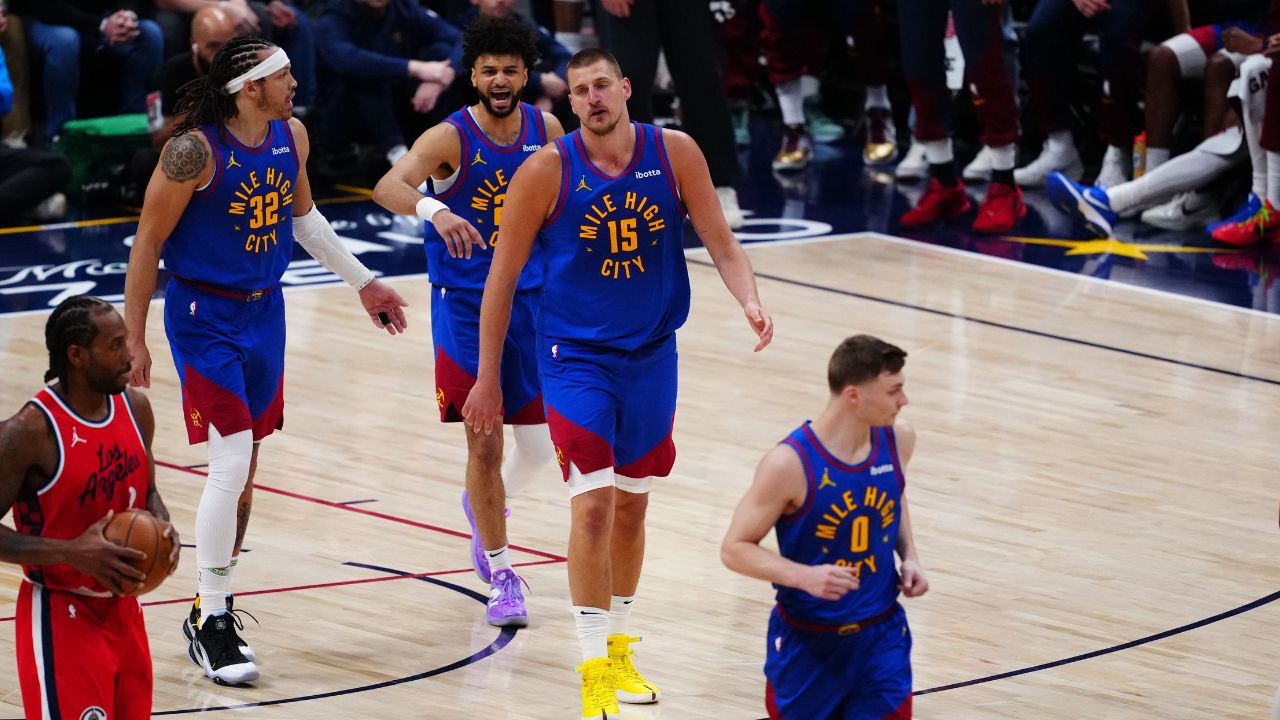 Denver Nuggets center Nikola Jokic (15), guard Jamal Murray (27) and Denver Nuggets forward Aaron Gordon (32)