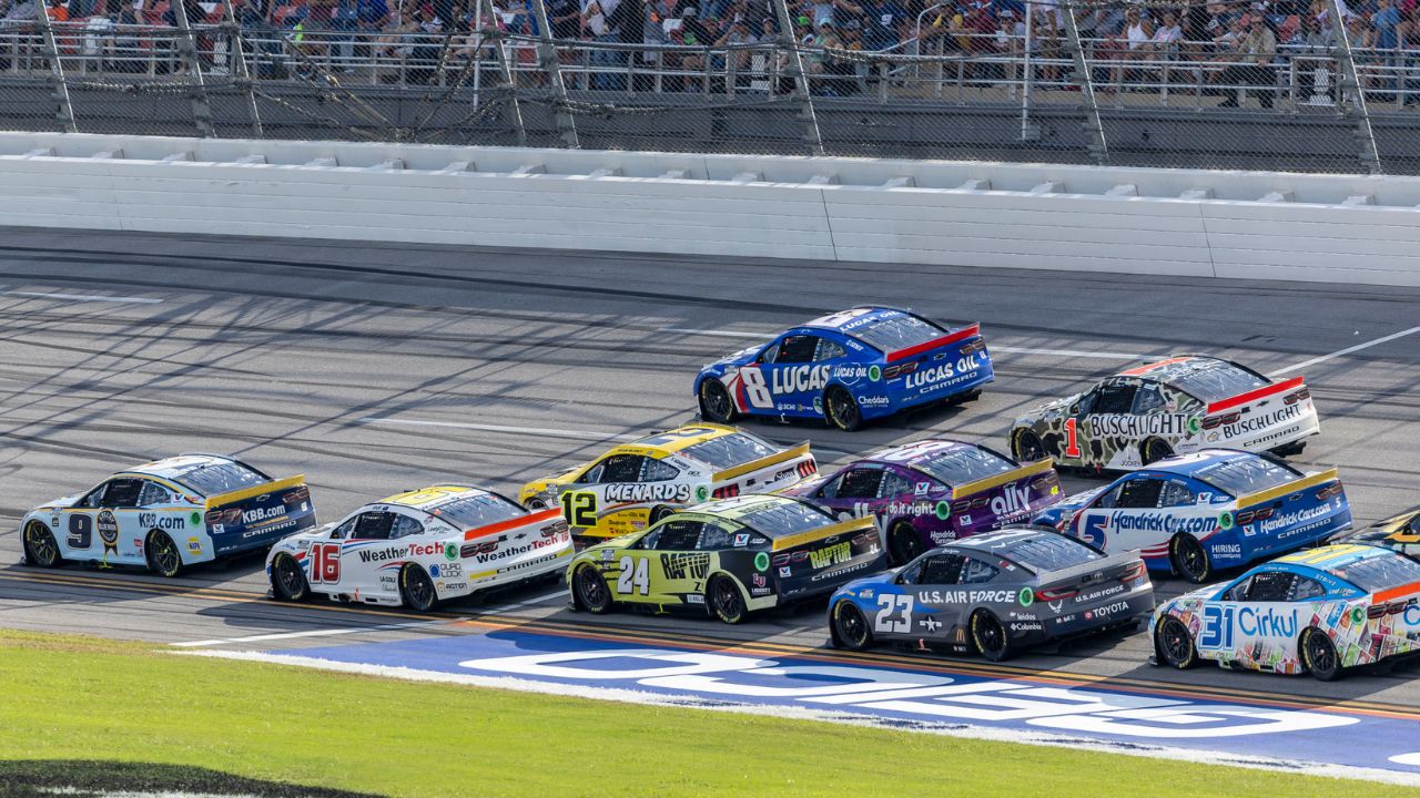 Ryan Blaney (12) and Ross Chastain (1) are part of the lead pack seconds before their wreck in the final laps during the second stage of the YellaWood 500 at Talladega Superspeedway.