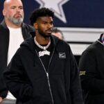 Quarterback Shedeur Sanders of Colorado (2) looks on from the sidelines during the first half against the East at AT&T Stadium.