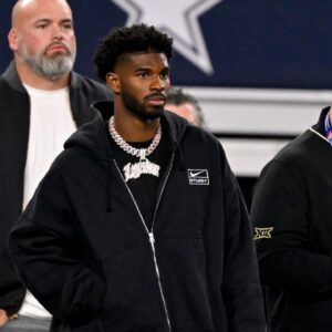 Quarterback Shedeur Sanders of Colorado (2) looks on from the sidelines during the first half against the East at AT&T Stadium.
