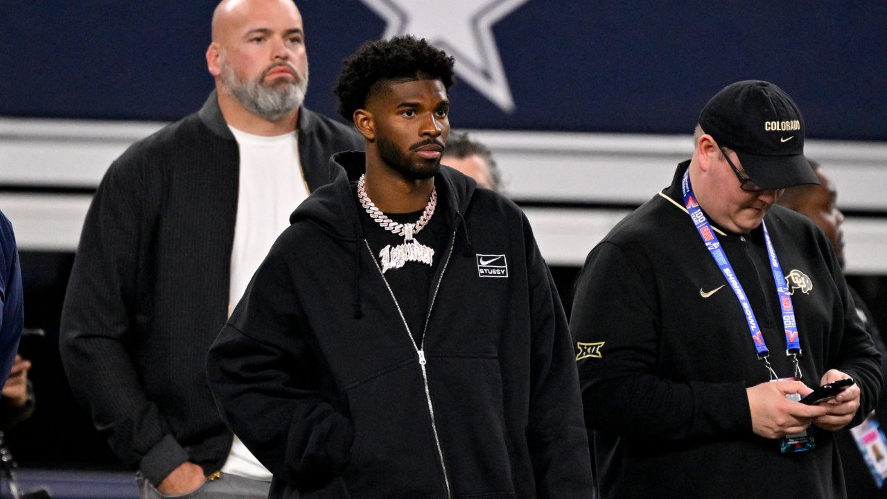 Quarterback Shedeur Sanders of Colorado (2) looks on from the sidelines during the first half against the East at AT&T Stadium.
