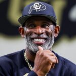 Colorado Buffaloes head coach Deion Sanders watches as his players go through drills at the University of Colorado NFL Showcase at the CU Indoor Practice Facility.