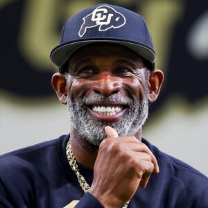Colorado Buffaloes head coach Deion Sanders watches as his players go through drills at the University of Colorado NFL Showcase at the CU Indoor Practice Facility.