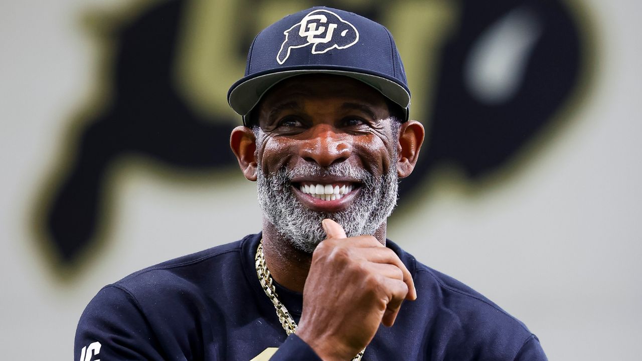 Colorado Buffaloes head coach Deion Sanders watches as his players go through drills at the University of Colorado NFL Showcase at the CU Indoor Practice Facility.