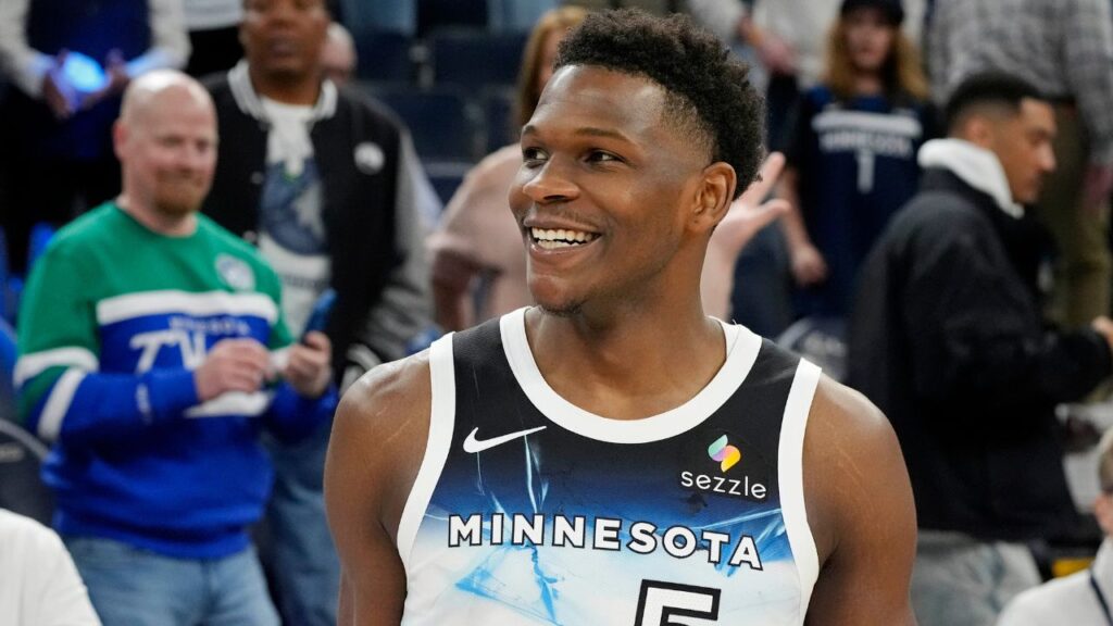 Minnesota Timberwolves guard Anthony Edwards (5) smiles after the game against the Brooklyn Nets at Target Center.