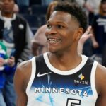 Minnesota Timberwolves guard Anthony Edwards (5) smiles after the game against the Brooklyn Nets at Target Center.
