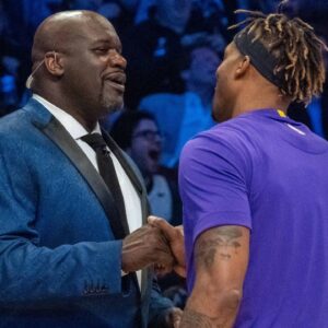 NBA great Shaquille O'Neal (left) shakes hands with Los Angeles Lakers player Dwight Howard (right) during NBA All Star Saturday Night at United Center.