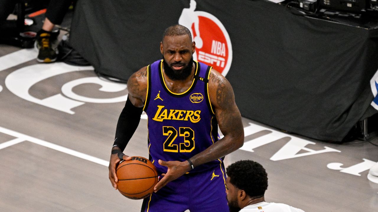 Los Angeles Lakers forward LeBron James (23) and Dallas Mavericks forward Naji Marshall (13) in action during the game between the Dallas Mavericks and the Los Angeles Lakers at American Airlines Center.