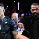 Tom Aspinall (L), Jon Jones (R)