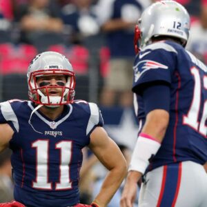 New England Patriots receiver Julian Edelman (11) talks with quarterback Tom Brady prior to the game against the Dallas Cowboys at AT&T Stadium.