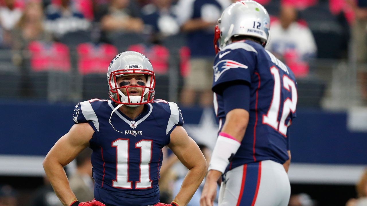 New England Patriots receiver Julian Edelman (11) talks with quarterback Tom Brady prior to the game against the Dallas Cowboys at AT&T Stadium.