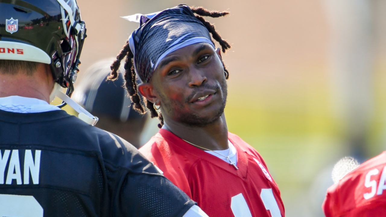 Jul 27, 2018; Flowery Branch, GA, USA; Atlanta Falcons wide receiver Julio Jones (11) talks to quarterback Matt Ryan (2) on the field during Training Camp at Falcons Training Complex.