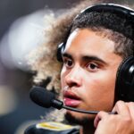 Carrollton Trojans quarterback Julian Lewis (10) watches on from the sidelines against the Westlake Lions during the first half at Grisham Stadium. The 15-year-old Carrollton High student has already committed to playing for the University of Southern California Trojans and has been considered one of the top high school quarterback prospects.