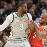 Houston Rockets guard Chris Paul (3) defends Cleveland Cavaliers guard Dwyane Wade (9) during the first half at Quicken Loans Arena
